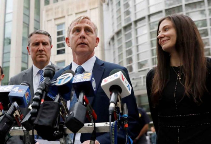 ARCHIVE PHOTO: Richard P. Donoghue, United States Attorney for the Eastern District of New York, speaks to the media after the guilty verdicts in the sex trafficking and racketeering case against Nxivm cult founder Keith Raniere outside the Brooklyn Federal Courthouse in New York, U.S., June 19, 2019. REUTERS/Shannon Stapleton