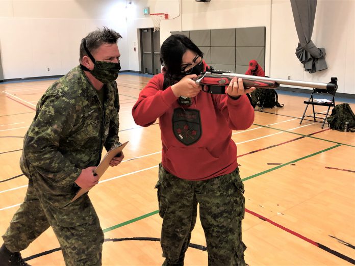 Master Warrant Officer Fergus O'Connor instructs Master Corporal Lilly Kejick on the correct use of the Ranger .308 rifle. Credit Warrant Officer Carl Wolfe