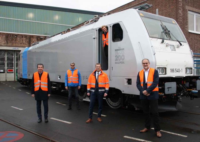 (From left) Mike Niebling, Director Sales TRAXX locomotives, Bombardier Transportation, Jörg Wurdinger, Head of Portfolio Railpool, Bombardier Transportation, Thomas Rendler, General Manager, Site Kassel, Bombardier Transportation, Johannes Kill, Head of Vehicle Projects, Railpool and Klaus Hiller, Head of Projects, Railpool, came together during the handover of the 200th TRAXX locomotive to Railpool at the Bombardier site in Kassel