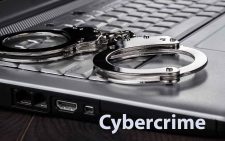 Cybercrime-handcuffs-on-laptop-cyber-crime-concept-P3J7FHN