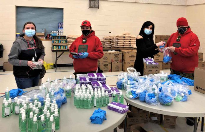 Preparing personal protective equipment packages for the residents of Ginoogaming are, from left, local worker Tracy Dore, Corporal Marianne Echum, local worker Shelley Franceschini, and Ranger Jody Grenier. Credit Warrant Officer Carl Wolfe