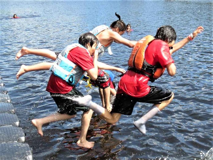 Junior Canadian Rangers jump into Springwater Lake for a cooling dip at Camp Loon 2019. credit Sergeant Peter Moon, Canadian Rangers