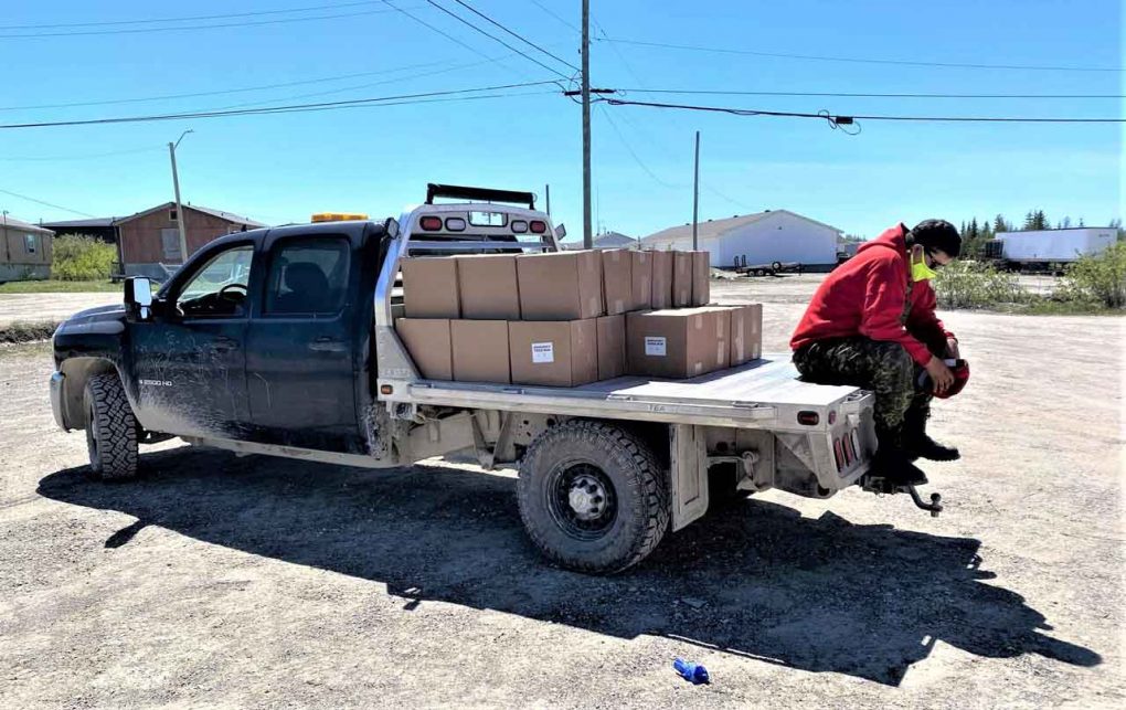 A tired Ranger Brandon Spence rests for a moment while delivering food to residents of Kashechewan. credit Canadian Rangers