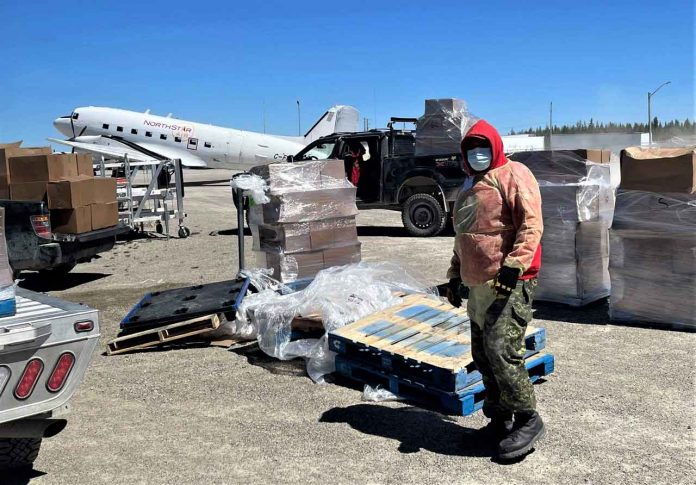 A tired Ranger Brandon Spence rests for a moment while delivering food to residents of Kashechewan. credit Canadian Rangers