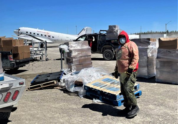 Ranger Malachi Wynne organizes food for delivery to families confined to their homes by a 24-hour curfew in Kashechewan. credit Canadian Rangers