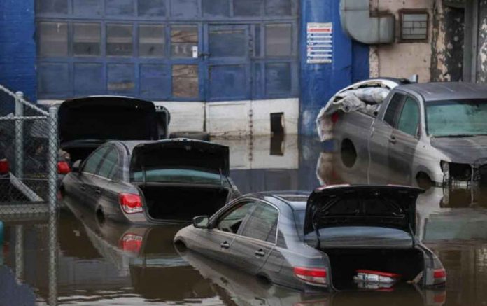 Cars sit in water after flooding in the Bronx borough of New York City, U.S., September 2, 2021. REUTERS/Caitlin Ochs