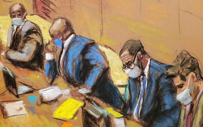 R. Kelly sits with his lawyers Deveraux Cannick, Calvin Scholar and Thomas Farinella as the jury deliberate in Kelly's sex abuse trial at Brooklyn's Federal District Court in a courtroom sketch in New York, U.S., September 27, 2021. REUTERS/Jane Rosenberg