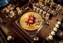 BITCOIN–gold-bit-coin-btc-coins-on-the-motherboard-bitcoi-2021-08-26-22-59-47-utc