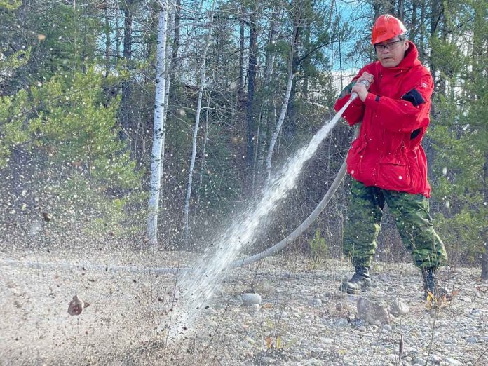 Canadian Ranger Hondy Atlookan from the Northern Ontario community of Fort Hope practices wildfire fighting techniques during a recent training exercise outside Thunder Bay as part of a new pilot project between the Canadian Armed Forces and the MNRF. MCpl Chris Vernon/photo