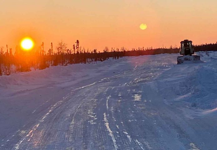 photo by Joshua Kataquapit Ice road building on the James Bay coast features many hours of operation of heavy equipment on the frozen mushkeg.