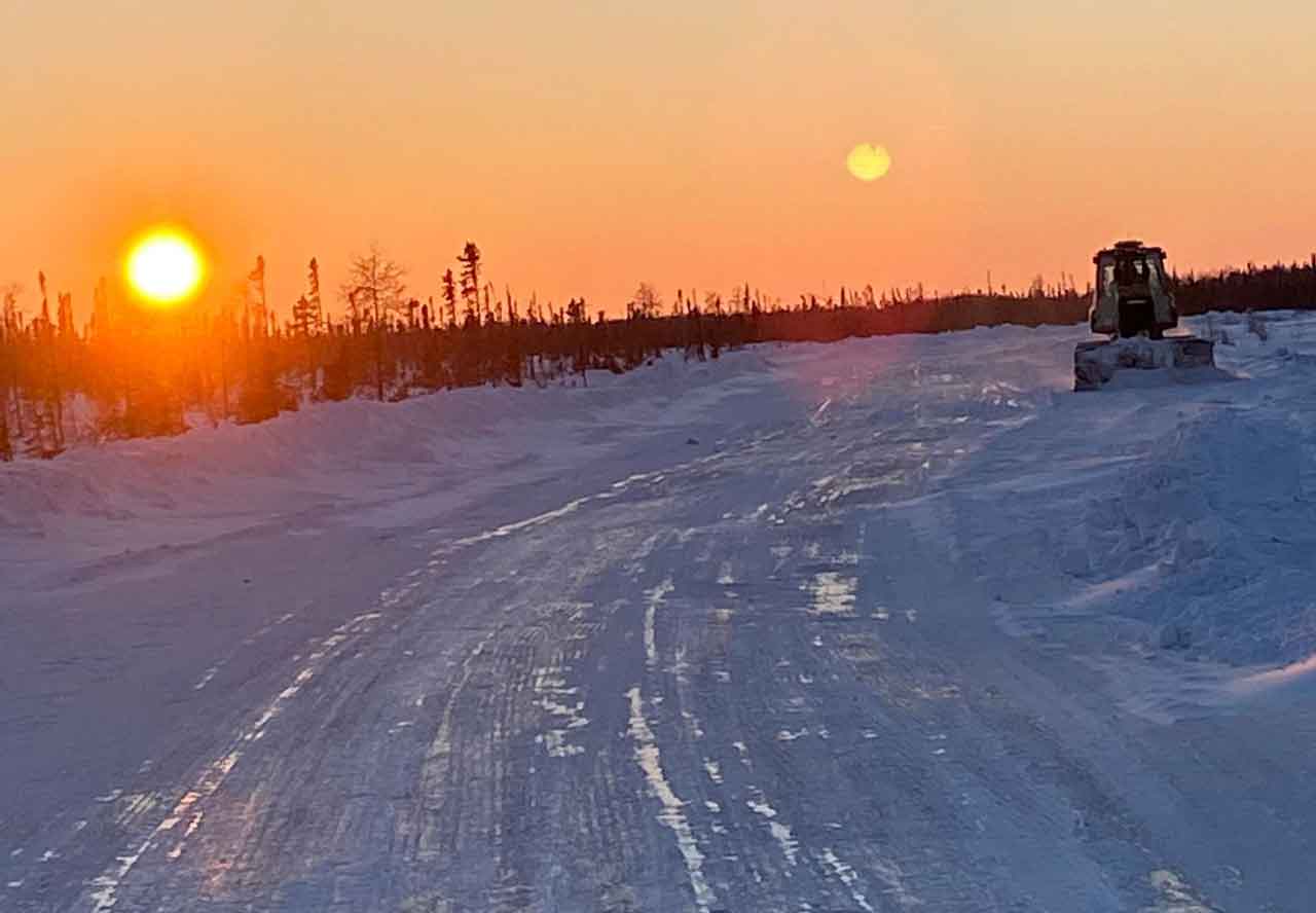 photo by Joshua Kataquapit Ice road building on the James Bay coast features many hours of operation of heavy equipment on the frozen mushkeg.