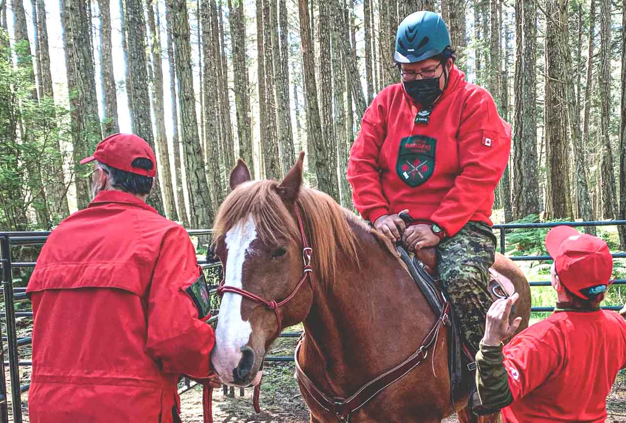 Master Corporal Leo Oskineegish of Nibinamik mounts a horse for the first time during training. credit Warrant Officer Terry Afflick