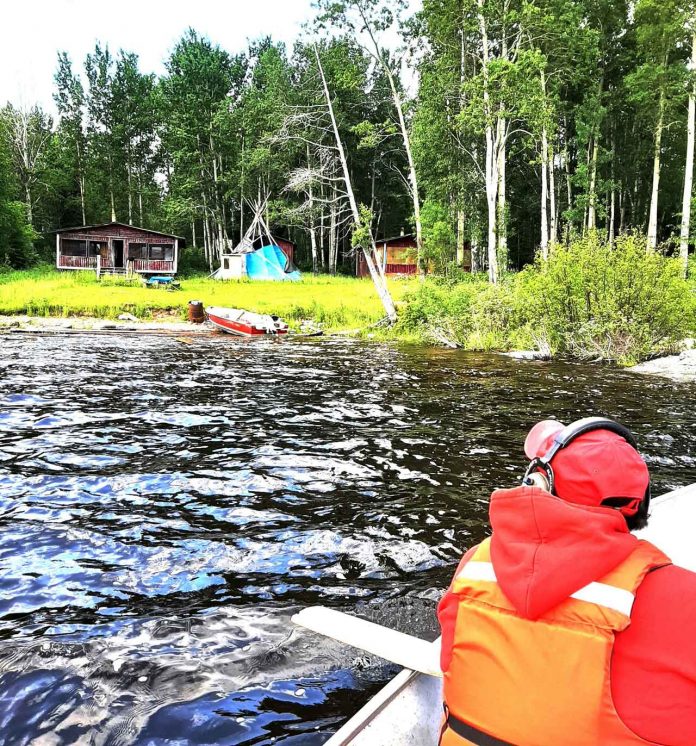 Canadian Rangers arrive at the missing fisherman's hunting camp by boat. credit Sergeant Spencer Anderson, Canadian Rangers