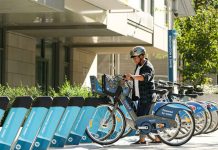 Vancouver Weather: Sunshine Followed by Rain A Mobi user starts an e-bike trip at a Mobi e-station.