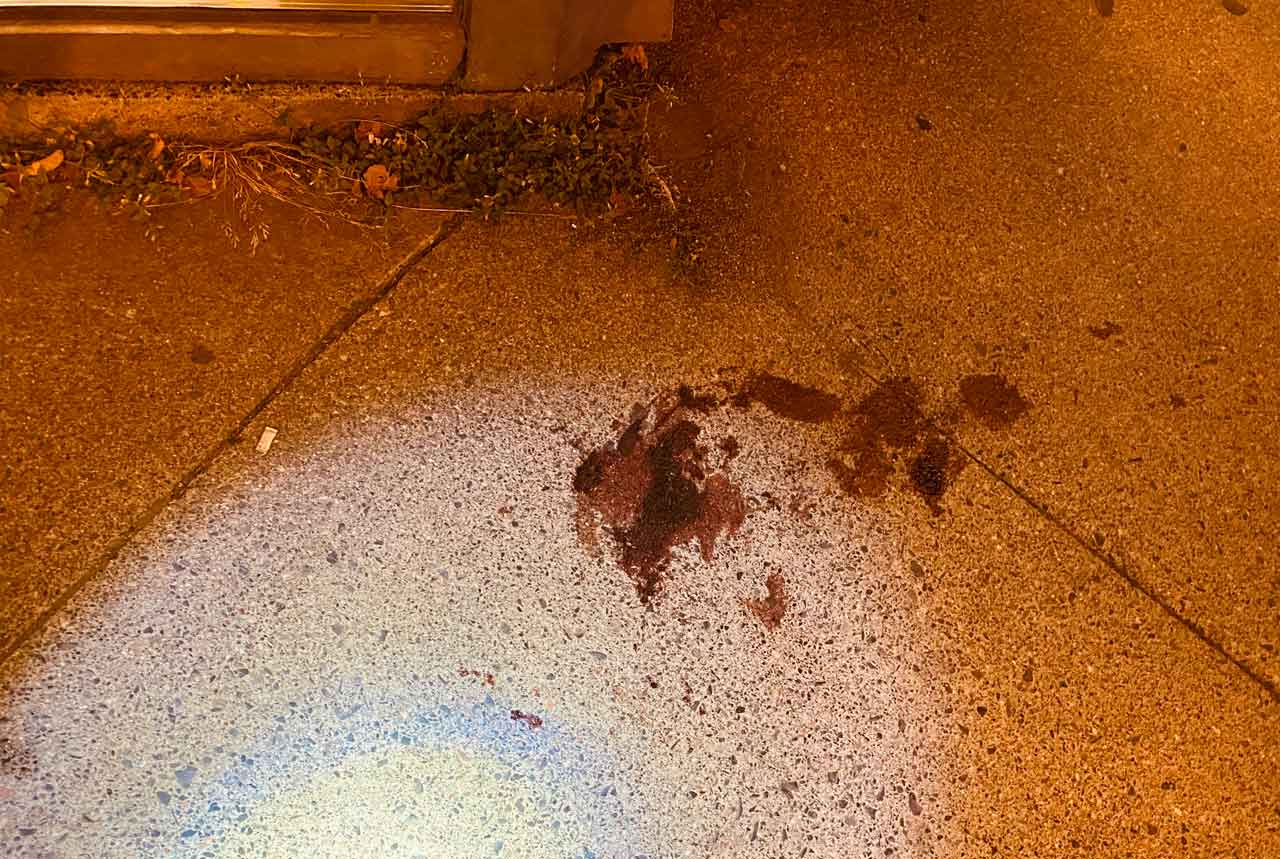 Blood on the sidewalk - Red River Road - September 12 2022.