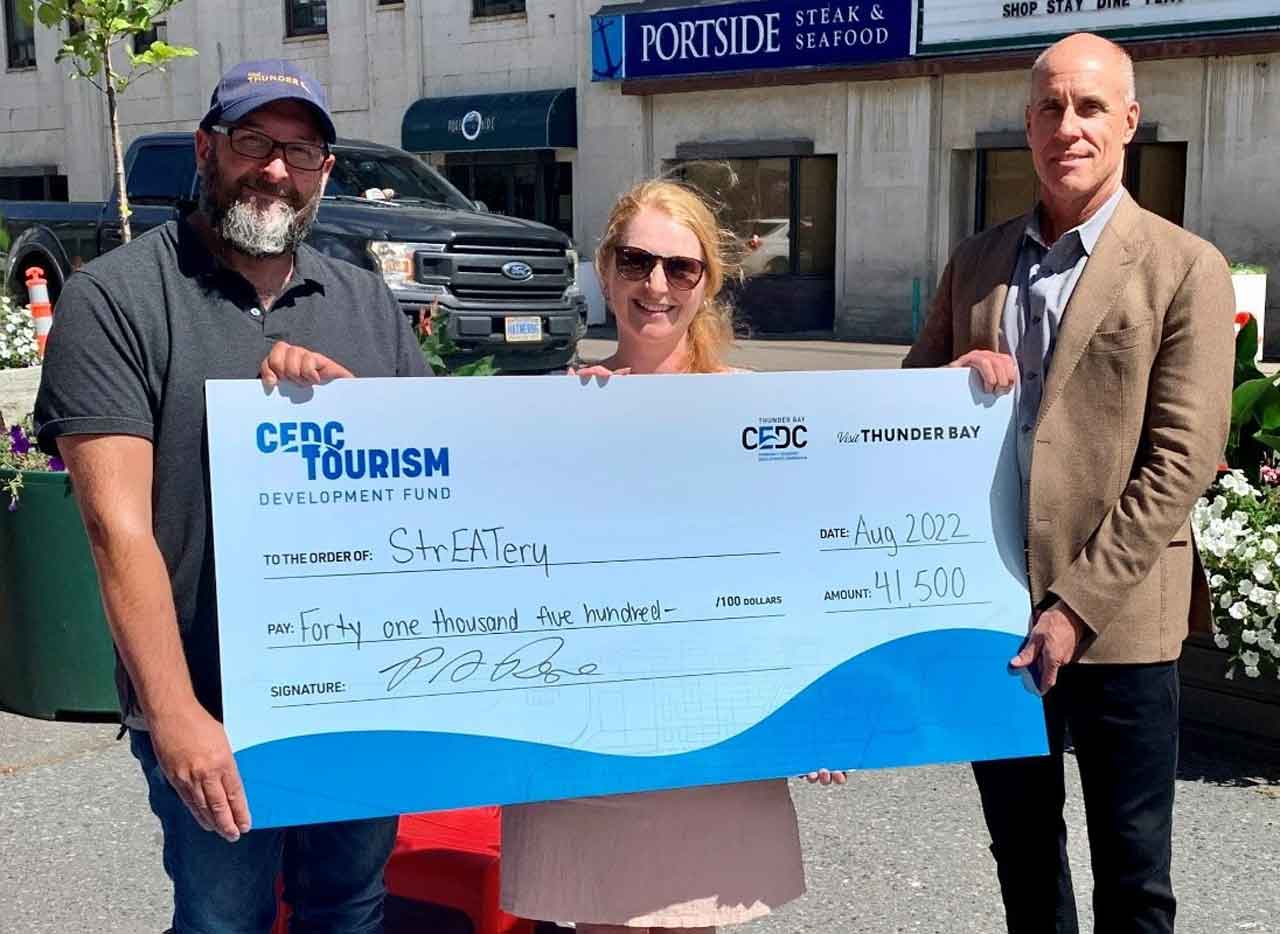 Cheque presentation with Paul Pepe Manager of Tourism, Kara Pratt Waterfront BIA Co-ordinator and Peter White Director of BIA Board of Management
