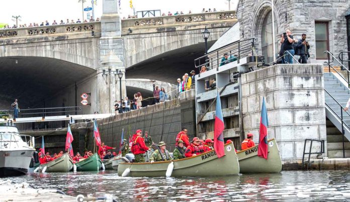 Canadian Ranger freighter canoes attract spectators in an Ottawa canal lock credit Canadian Rangers