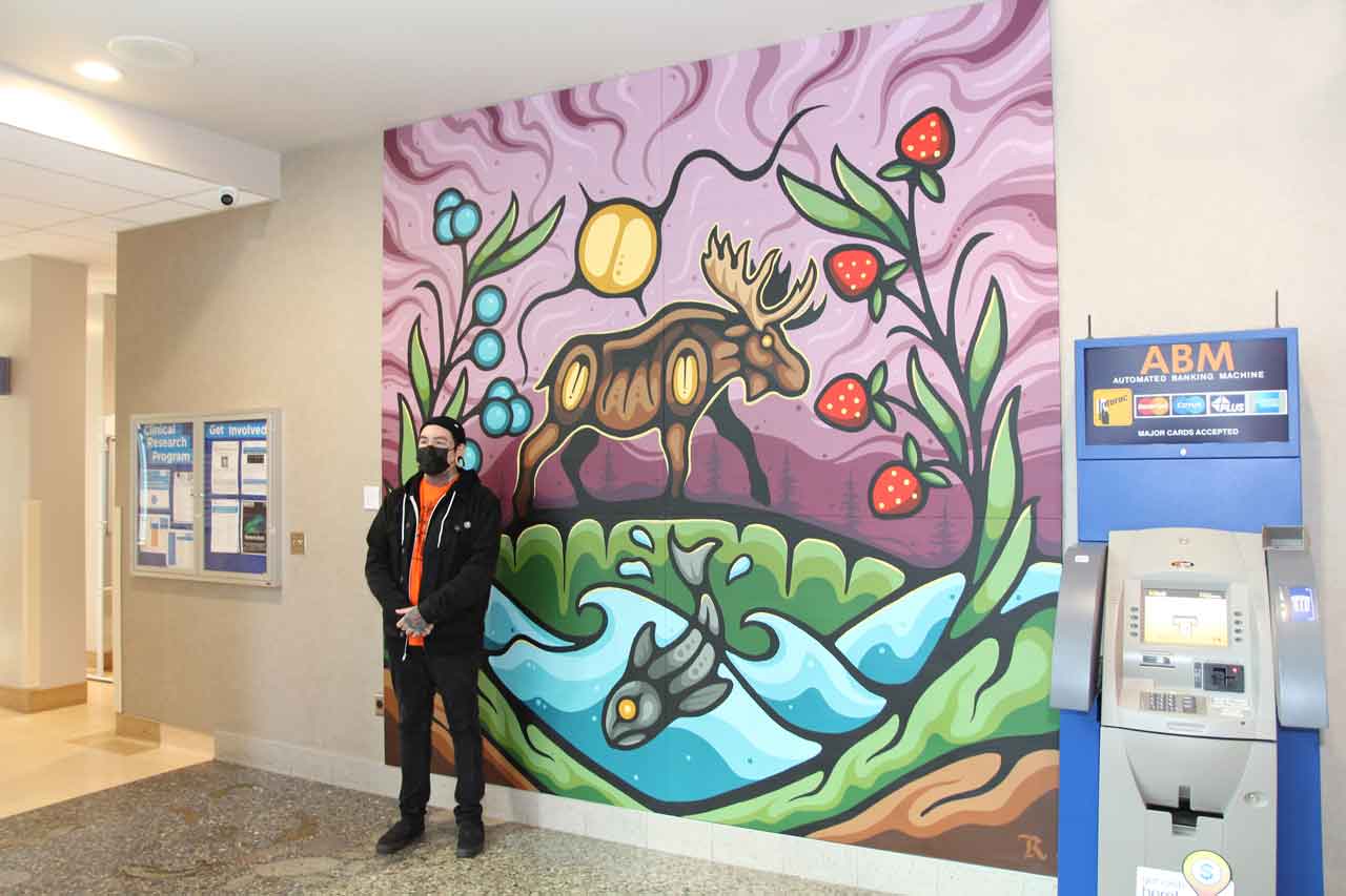 Ojibwe artist Ryan Pooman (member of Fort William First Nation) was commissioned to create the ten foot by ten foot mural that welcomes patients, families, visitors and staff to the cafeteria, located inside Thunder Bay Regional Health Sciences Centre.