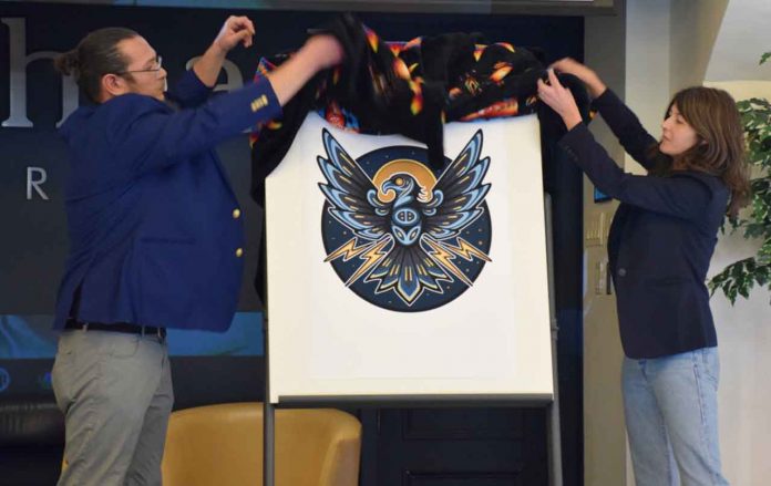 Co-Directors Robin Sutherland, left, and Larissa Speak unveiled the Institute's new logo, a Thunderbird