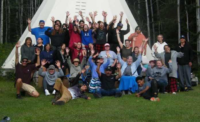 photo provided by Wabun Health Services Land Based Teachings were featured during a recent gathering of Wabun Tribal Council youth. Here we see the group of youth with organizers, chaperones and facilitators.