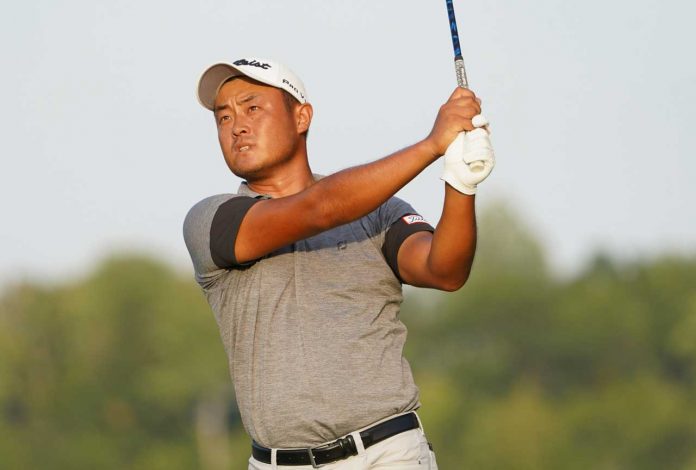 Yi Cao Leads by Five