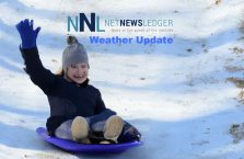 Winter-2023-2024-Child-sliding-down-hill-on-saucer