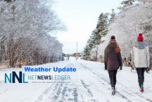 Winter-2023-24-Weather-Splash-Walking-along-Roadway-two-people