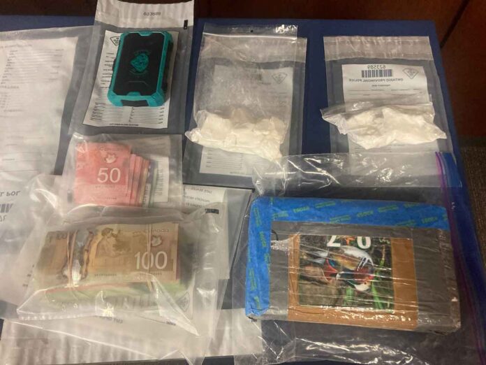 Law enforcement officials seized over a kilogram of suspected cocaine, firearms, and significant amounts of Canadian currency, estimating the street value of the drugs at approximately $126,200
