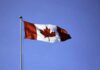 How Blockchain is Being Used in Ontario’s Fintech Corridor Canadian flag on a pole