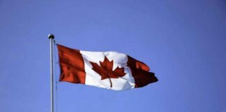 How Blockchain is Being Used in Ontario’s Fintech Corridor Canadian flag on a pole