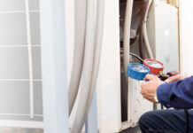 The Silent Warning: Why Your Vaughan Home’s AC Rarely Breaks Without Notice Technician is checking air conditioner ,measuring equipment for filling air conditioners.