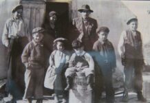 UNDER THE NORTHERN SKY Goodbye To The Hudson Bay Company photo supplied by Kataquapit family Kataquapit family photo from the 1940s with Chief James Kataquapit, standing with a hat and pin signifying his leadership and his wife Janie Kataquapit standing in back at the door. Chief Kataquapit was also a veteran of the First World War. From L-R: Thomas, Marius, Celine, David, Gabriel and Alex. Missing are brothers George and Leo.