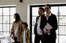 Family and real estate agent visiting a property