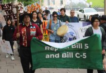 First Nation Youth Protest Ottawa National Meeting Regarding Bill C5 photo by Ray Hookimaw, Attawapiskat FN A surprise rally of First Nation youth protesters walked to the entrance of the Canadian Museum of History in Gatineau, Quebec where hundreds of Chiefs from across Canada were meeting with Prime Minister Mark Carney concerning Bill C5. In front holding the banner from L-R are: Ramon Kataquapit, Attawapiskat FN and Cohen Chisel, Lac Seul FN.