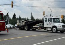 No Injuries Reported in Car Fire on Balmoral Burnt vehicle being loaded on tow truck