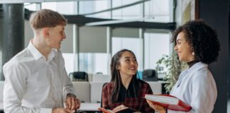 Top 5 Smart Contract Audit Companies: How to Select the Right One Office team members engaging