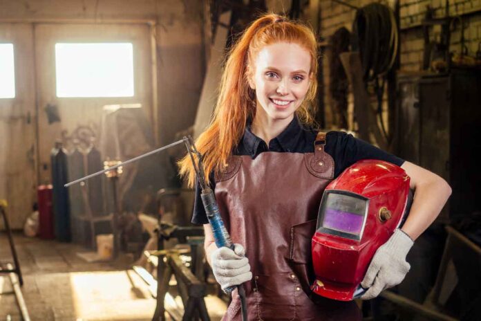 strong-and-worthy-pretty-redhead-ginher-woman-wear-2024-10-31-02-13-10-utc MIG welding relies on a continuous wire electrode and a shielding gas.