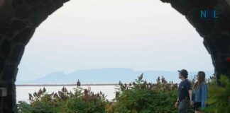 August 17, 2026: Thunder Bay Weather — Fog Clears for a Sunny 25°C Monday Before Showers Tonight Couple walking at Marina Park with Sleeping Giant in background