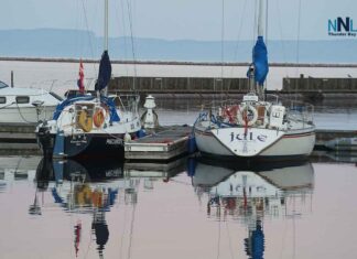 Thunder Bay faces showers and wind gusts to 70 km/h Tuesday before sunshine and 22°C Thursday Two sailboats docked Marina Park Sept 2025