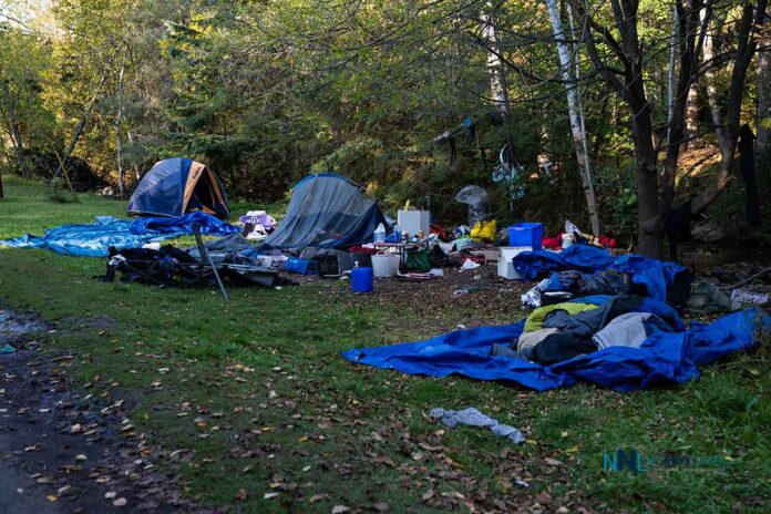 Abandoned tent encampment along McVicars Creek - October 4 2025