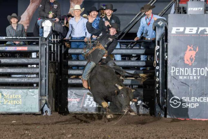Marcus Mast prevailed at PBR Reading to hold the event buckle up high Saturday night, covering two of his three bulls in Santander Arena