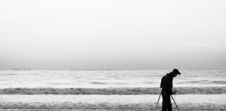 Beachcombing and Treasure Hunting: Hidden Finds Along the Great Lakes Shorelines Photo by 书畅 何: https://www.pexels.com/photo/silhouette-of-man-beachcombing-on-peaceful-shore-35093341/