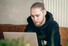 What Happens When a First-Time Depositor Skips the Terms Review at a Canadian Casino Man at computer