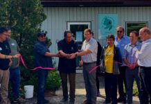 Cat Lake First Nation opens a Dryden natural resources office to expand forestry and energy development Chief Russell Wesley cutting ribbon (left) with Jack Harrison Mayor of the City of Dryden (right)