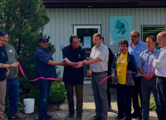 Cat Lake First Nation opens a Dryden natural resources office to expand forestry and energy development Chief Russell Wesley cutting ribbon (left) with Jack Harrison Mayor of the City of Dryden (right)